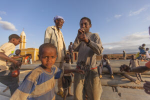 young boy magic trick kenya sunset playing action