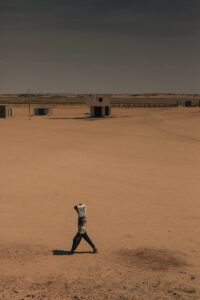 man carrying water desert sudan wadi halfa tank