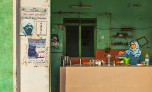 woman pouring tea in wadi halfa sudan village